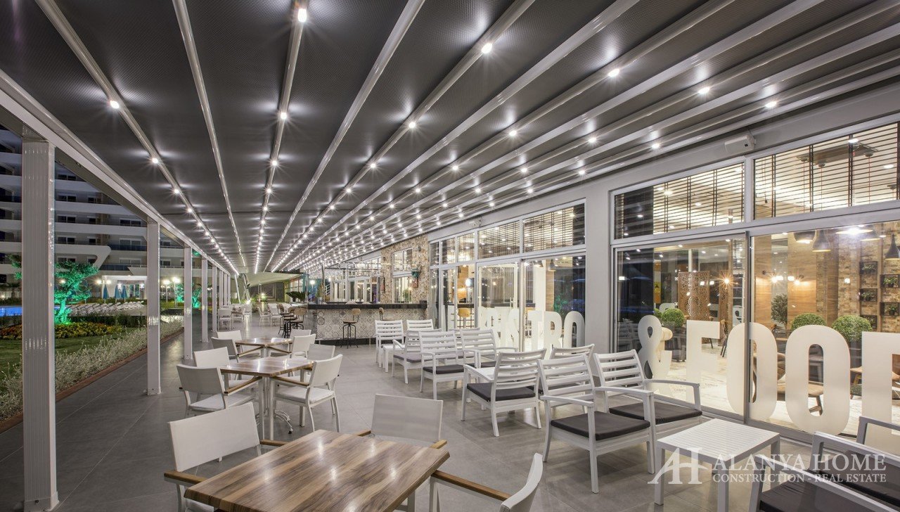 Фото купить продать недорогую квартиру недвижимость в доме жилом комплексе с кафе ресторанами Алания