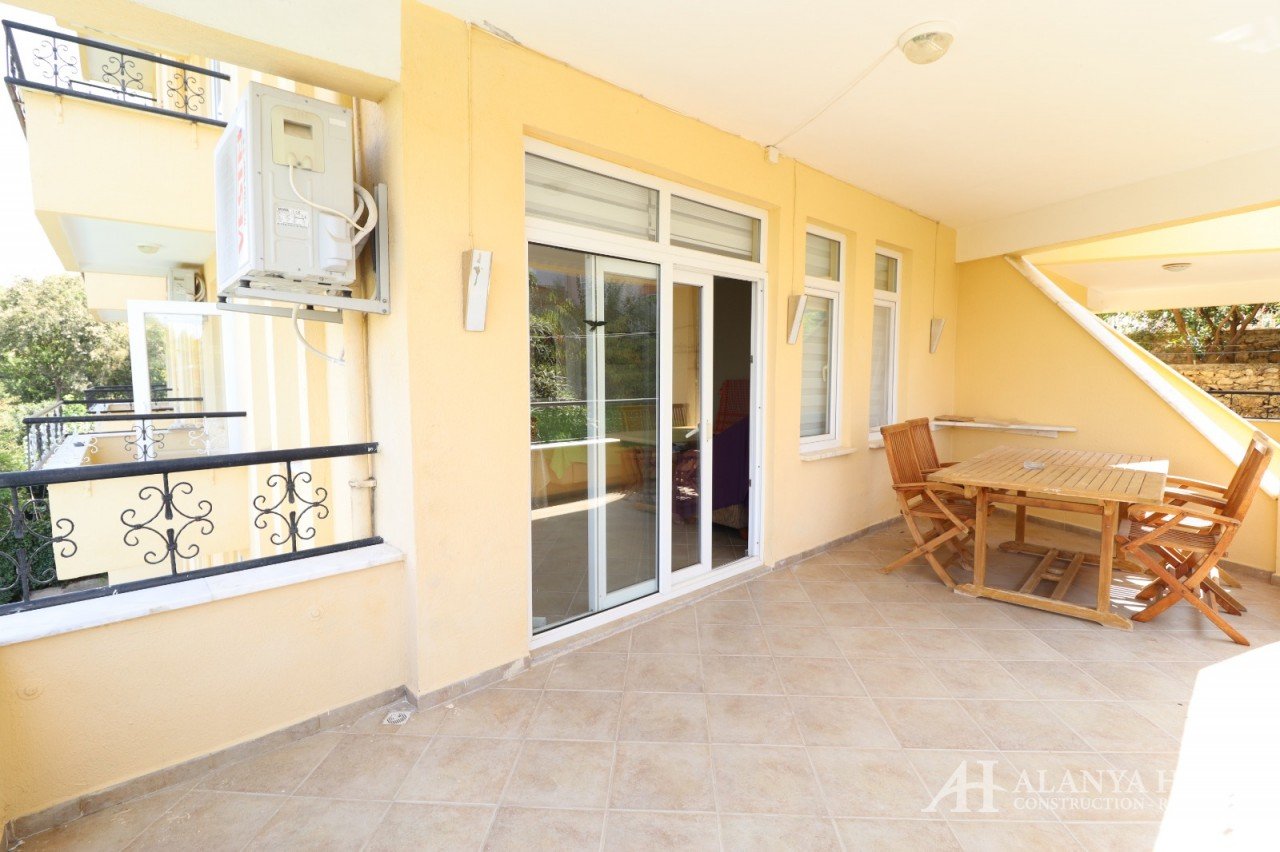 Фото покупка продажа недорогая двухкомнатная квартира 1+1 c большим застекленным балконом Алания Хоу