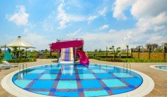 Фото купить продать недорогую квартиру недвижимость в доме жилом комплексе с открытым бассейном Алан